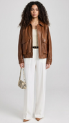 JACKERO women's cognac brown leather bomber jacket featuring drop shoulders and large dual flap front pockets.