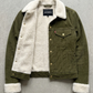 Green jacket with white fur lining on a gray background