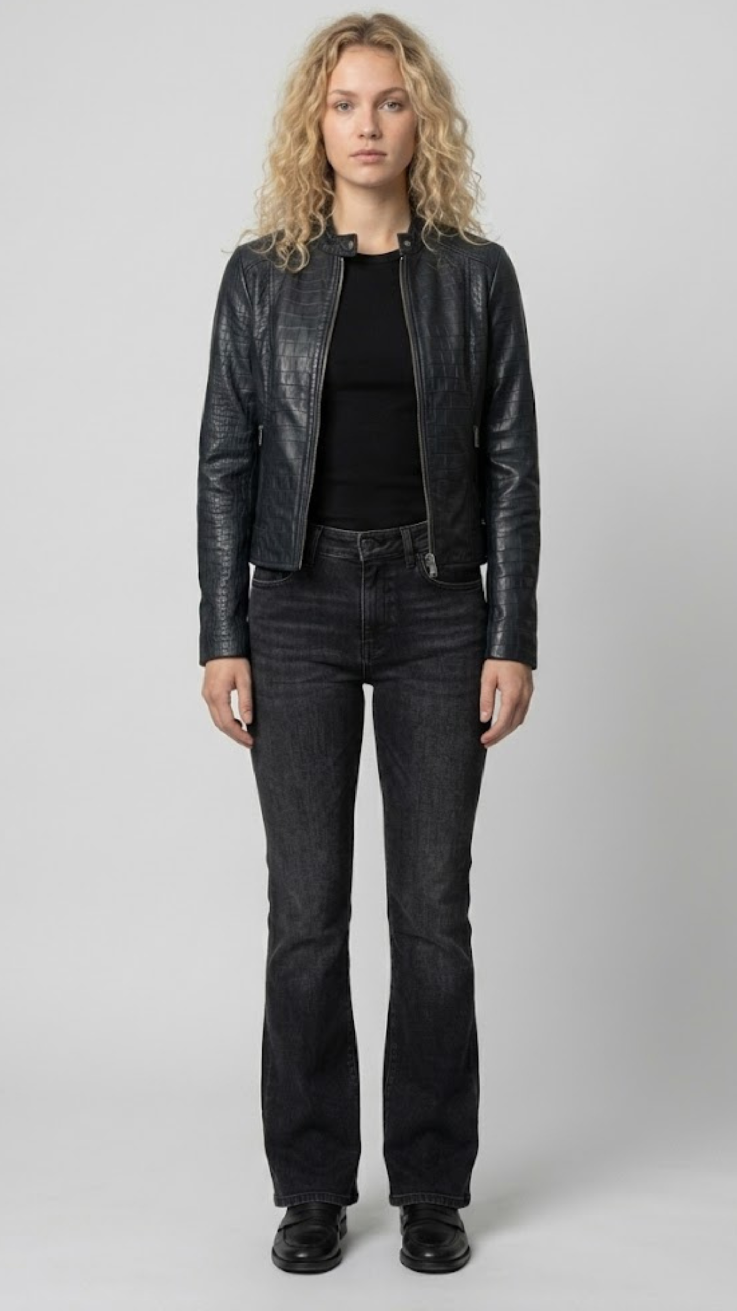 Front full view of a premium women's black leather jacket showcasing a bold crocodile embossed texture and elegant asymmetric zipper closure.