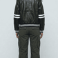 Straight-on back view of the classic Jackero black leather cafe racer jacket showing clean seams and shoulder structure.