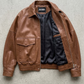 Premium women's cognac tan real leather jacket with large flap pockets for luxury autumn collection.