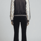 Breathable and lightweight dark navy striped jacket layered over a casual t-shirt for an effortless streetwear style.