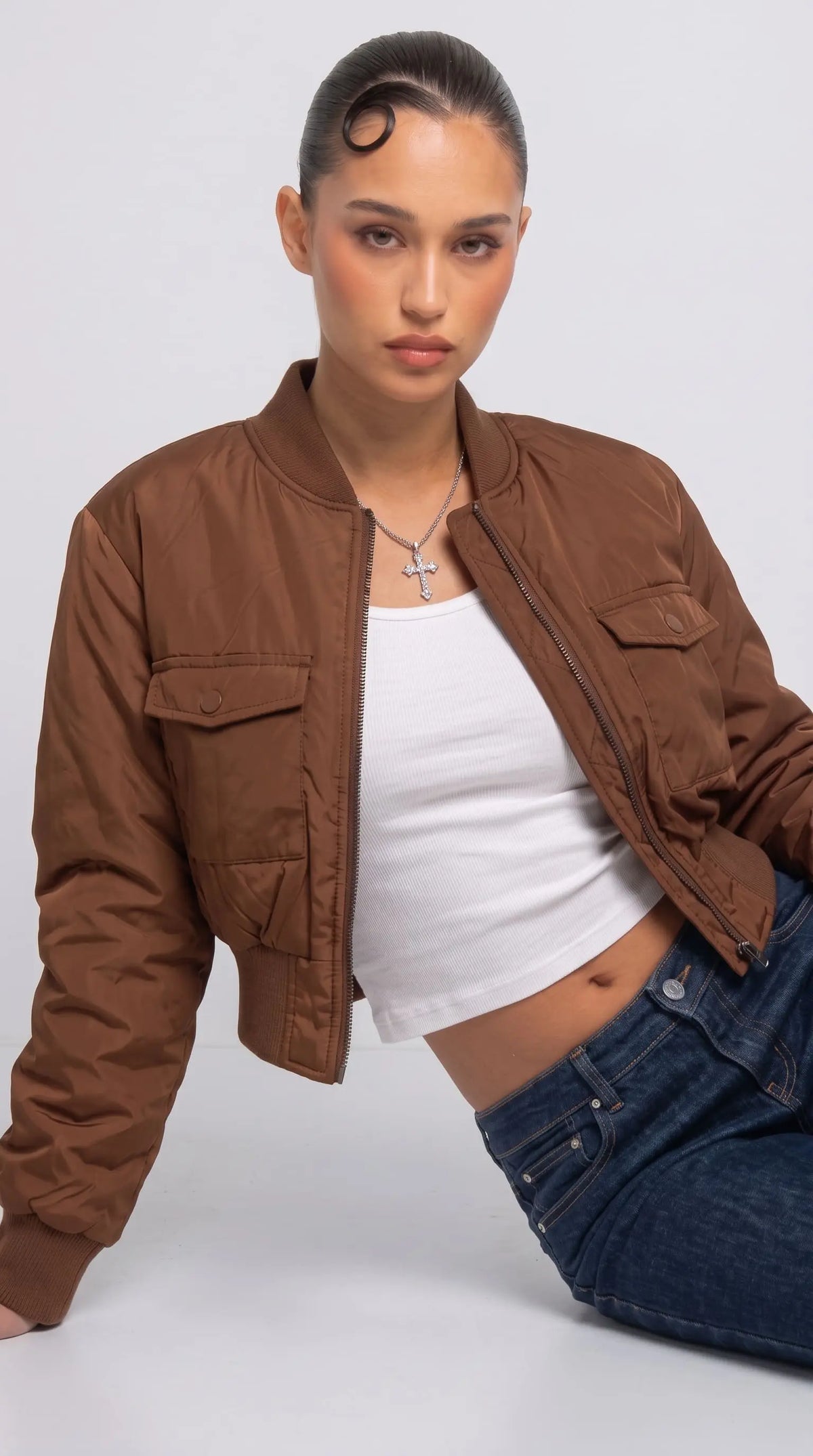 Close-up shot showcasing the soft weave and luxury premium sheen of a high-quality tan silk cotton blend fabric.
