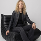 Women's contemporary luxury streetwear fashion featuring a sleek black crocodile textured leather jacket styled for an edgy, high-end look.
