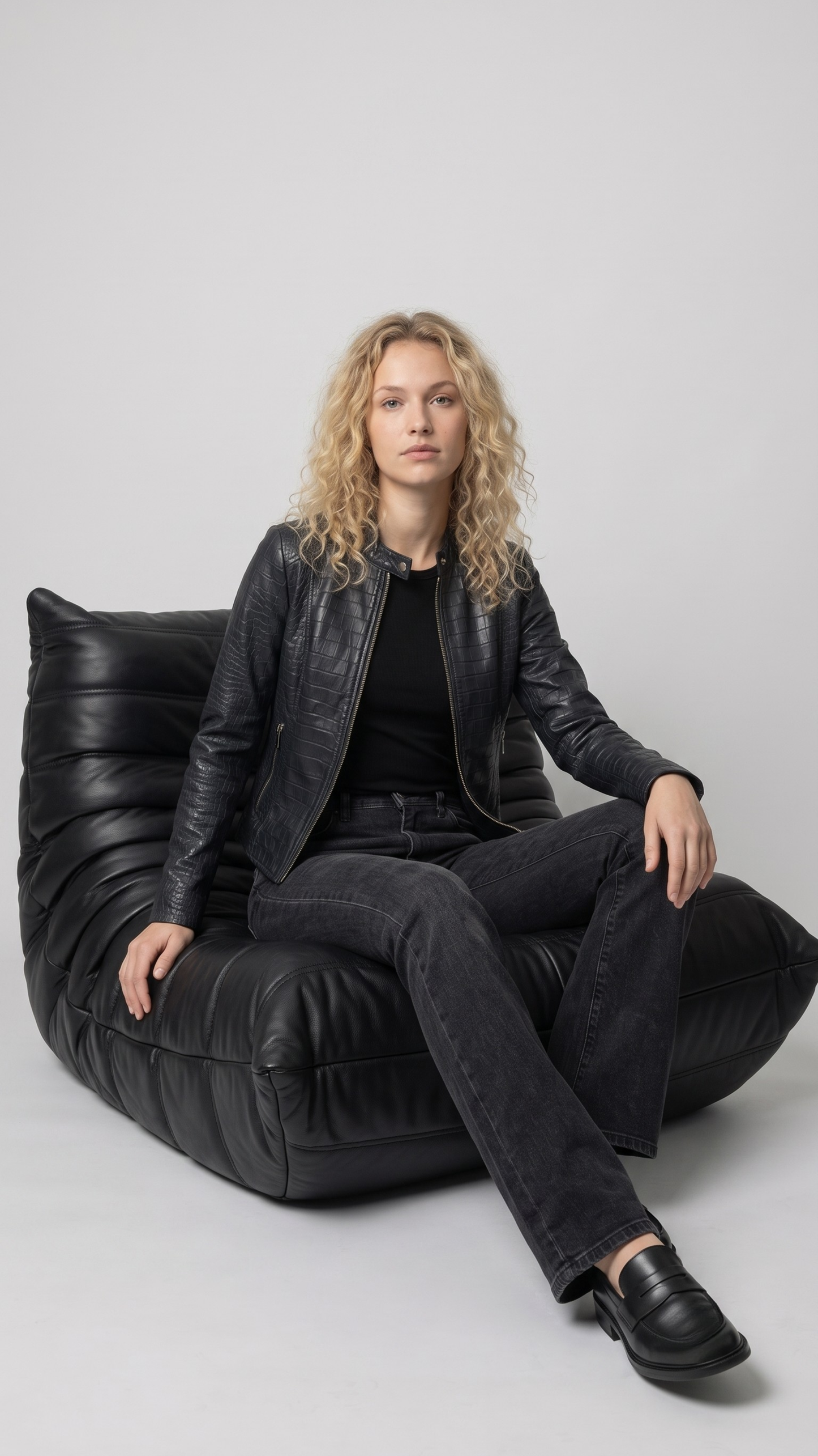 Women's contemporary luxury streetwear fashion featuring a sleek black crocodile textured leather jacket styled for an edgy, high-end look.