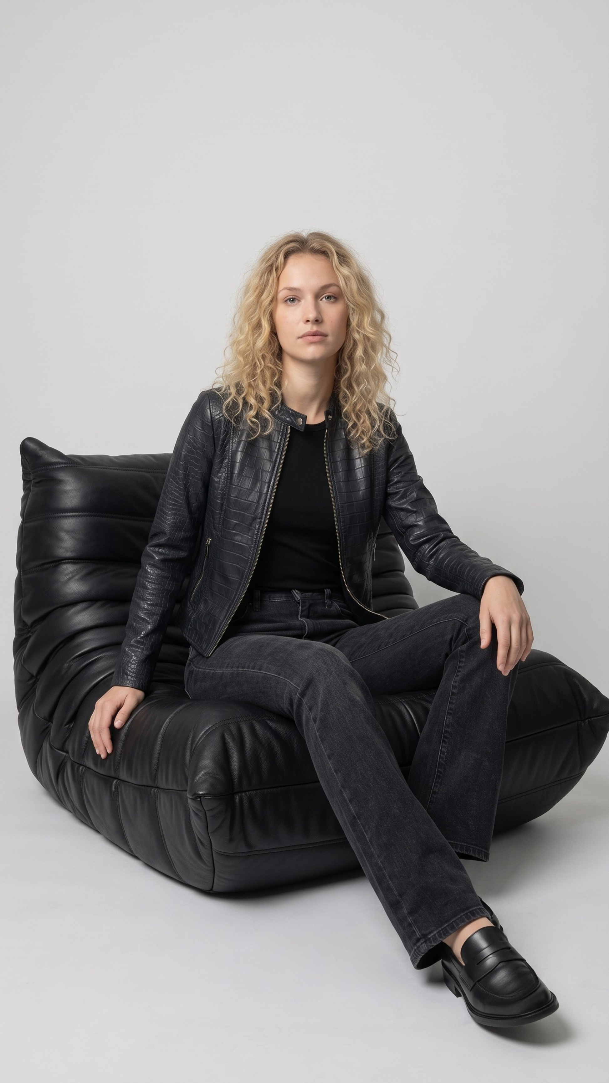 Women's contemporary luxury streetwear fashion featuring a sleek black crocodile textured leather jacket styled for an edgy, high-end look.