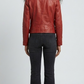 Straight-on back view of a structured red leather motorcycle jacket showcasing its tailored paneling and sharp shoulder line.