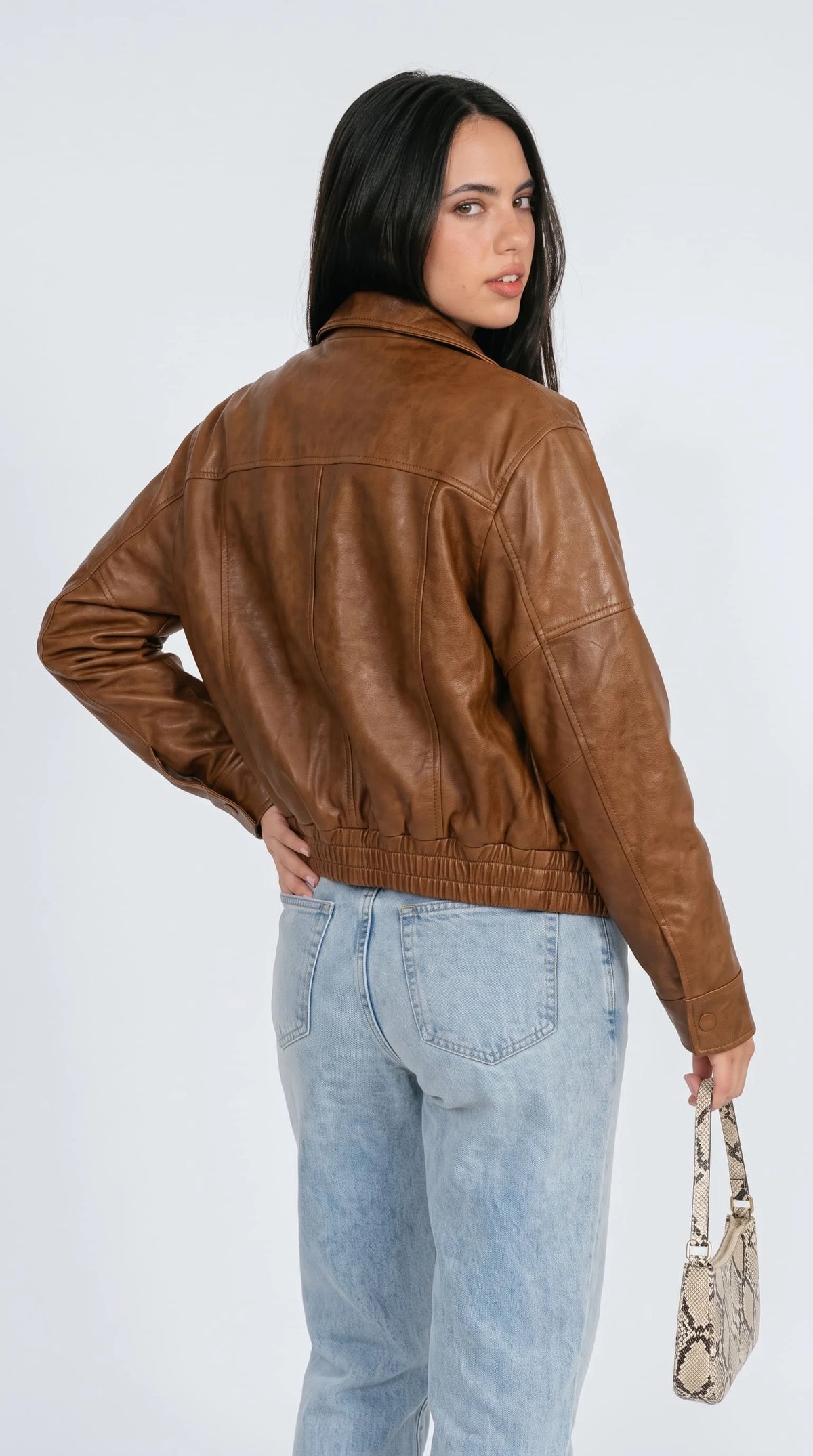 Buy women's camel brown real lambskin leather bomber jacket online, soft smooth finish with raglan sleeves, snap cuff details, elastic hem and gold hardware, durable and stylish winter wear