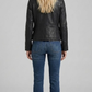 western back yoke panel and tailored seams of the onyx leather coat.