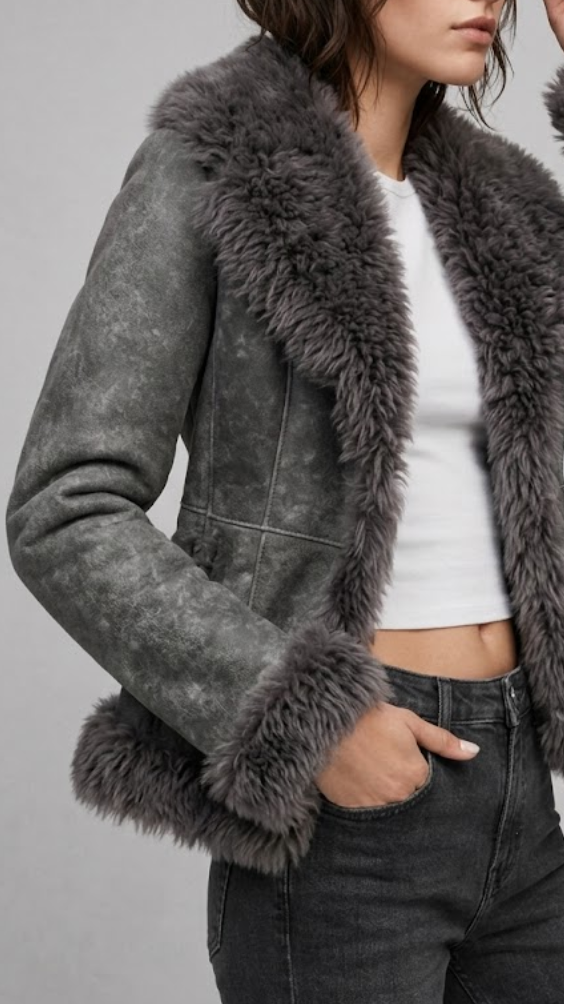 Tailored slim-fit women's grey suede shearling jacket with open front and soft shearling lining.