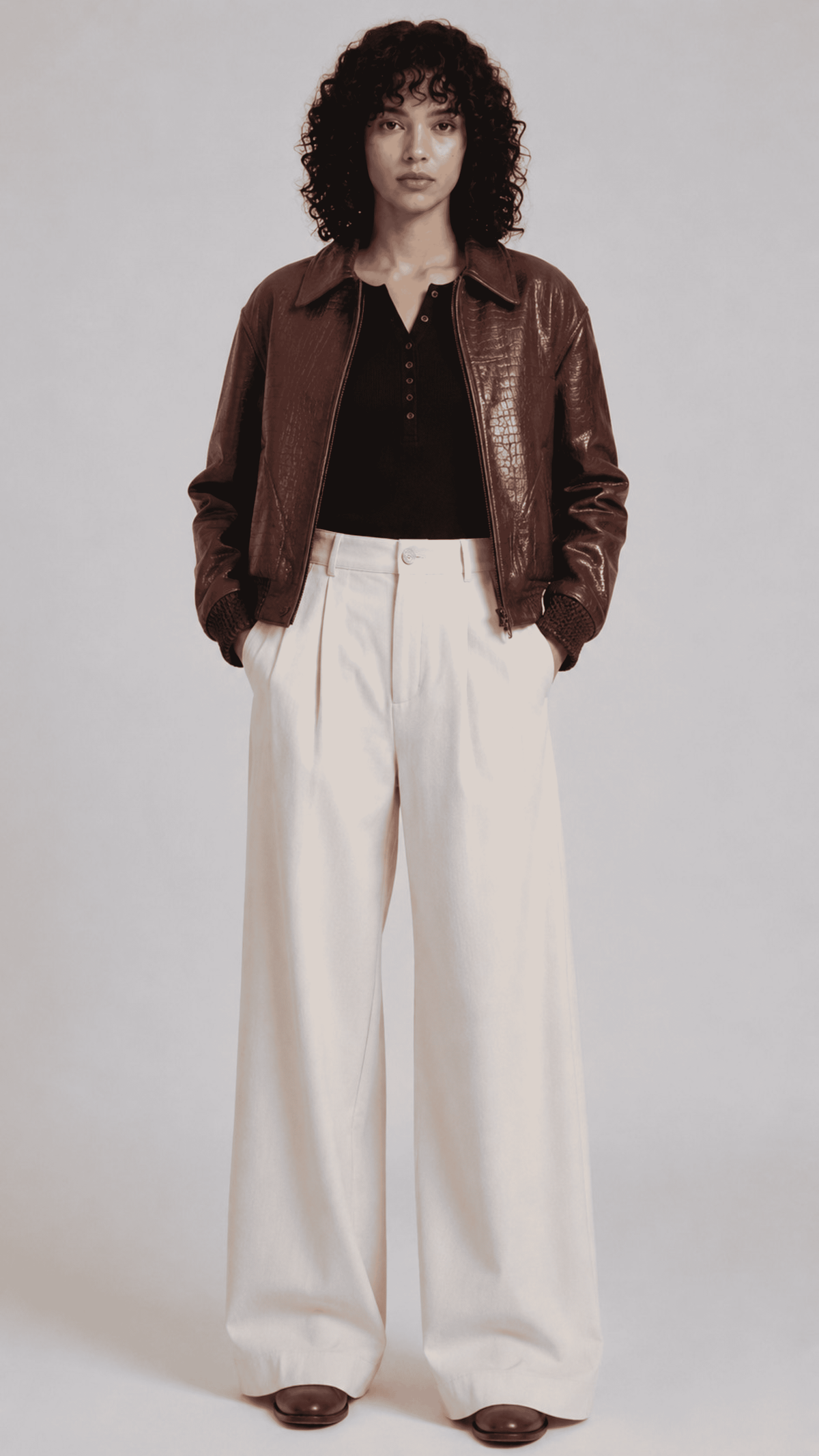 Women's rich brown leather bomber jacket featuring a glossy crocodile embossed texture and shirt collar.