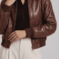 Structured women's brown croc leather coat with a relaxed bomber silhouette and gathered waist.