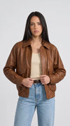 Women's tan brown genuine leather bomber jacket with classic pointed collar, full zip front closure, flap chest pockets and ribbed elastic waistband, vintage style premium outerwear for women