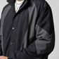 Close-up shot of lightweight dark grey nylon fabric texture and sturdy contrast zipper track
