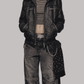 JACKERO dark black oversized leather Y2K jacket showcasing a thick, contrasting plush brown fur collar and front zipper.